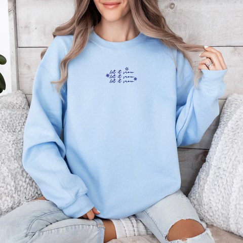 Let It Snow on Light Blue Gildan Heavy Blend Sweatshirt