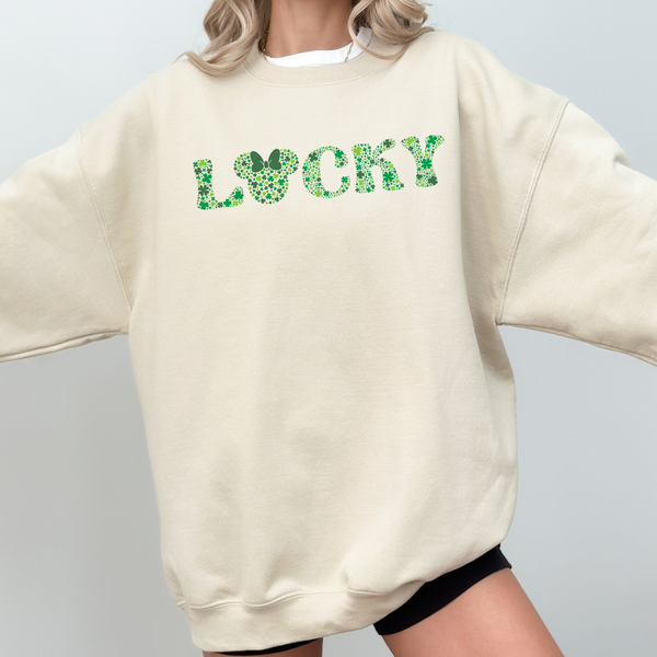 Beige sweatshirt with 'LUCKY' in green letters on a plain background
